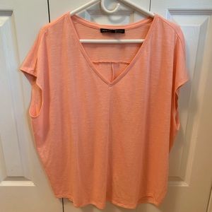 White House Black Market Jetsetter t-shirt with dolman sleeves in light peach.